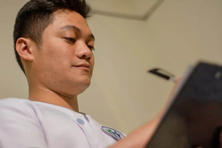 A student writes in a patient record